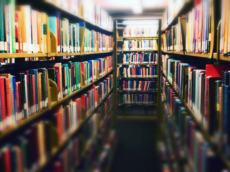 A colorful aisle of books at the Michener Library at the University of Northern Colorado