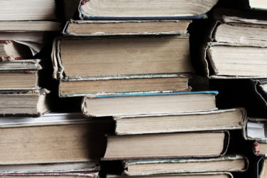 Close-up of a large stack of old books