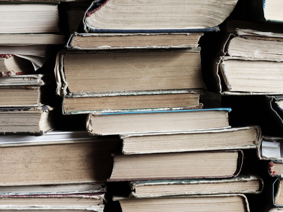 Close-up of a large stack of old books