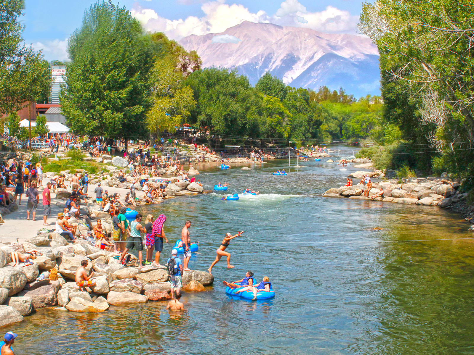 People jump into the Arkansas River in Salida