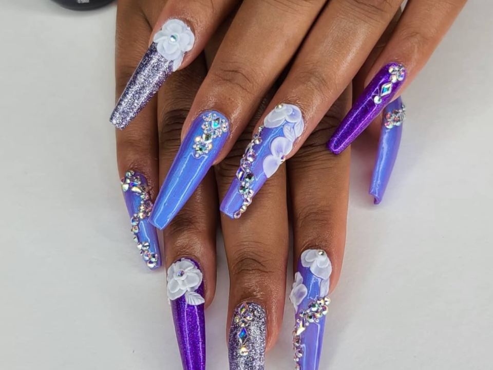 Long purple nails with gems