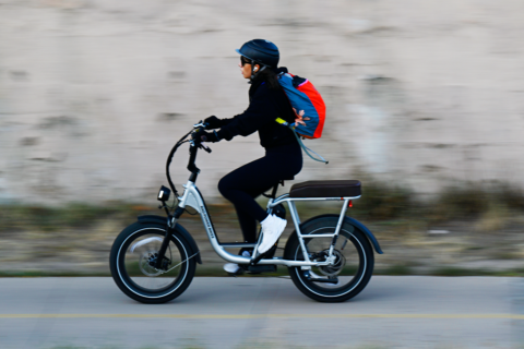 A rider travels along Cherry Creek Trail on an e-bike