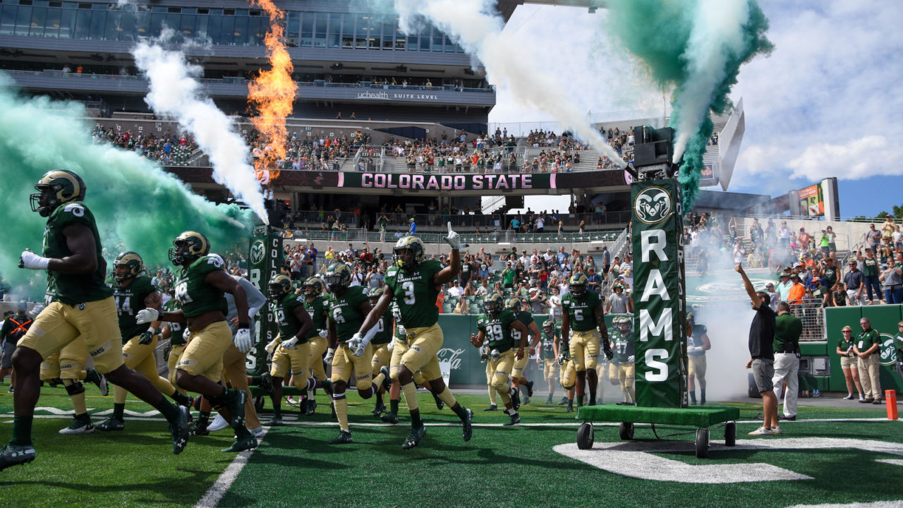 CSU football players run onto the field