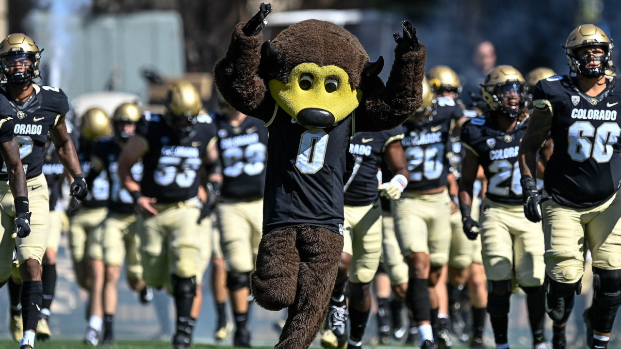 CU football mascot Chip runs onto Folsom Field ahead of the team