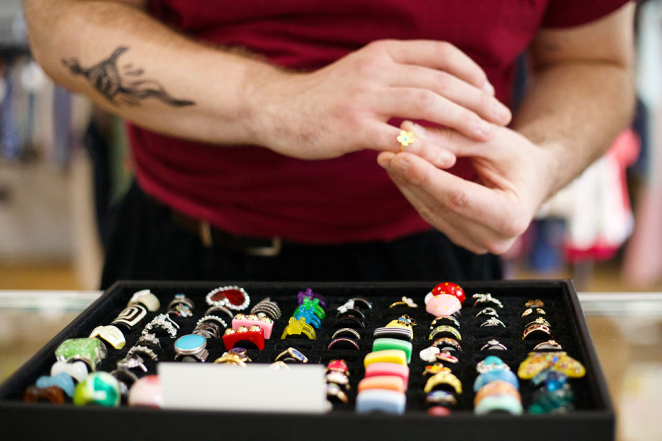 A person trying on quirky rings at Strawberry Mountain