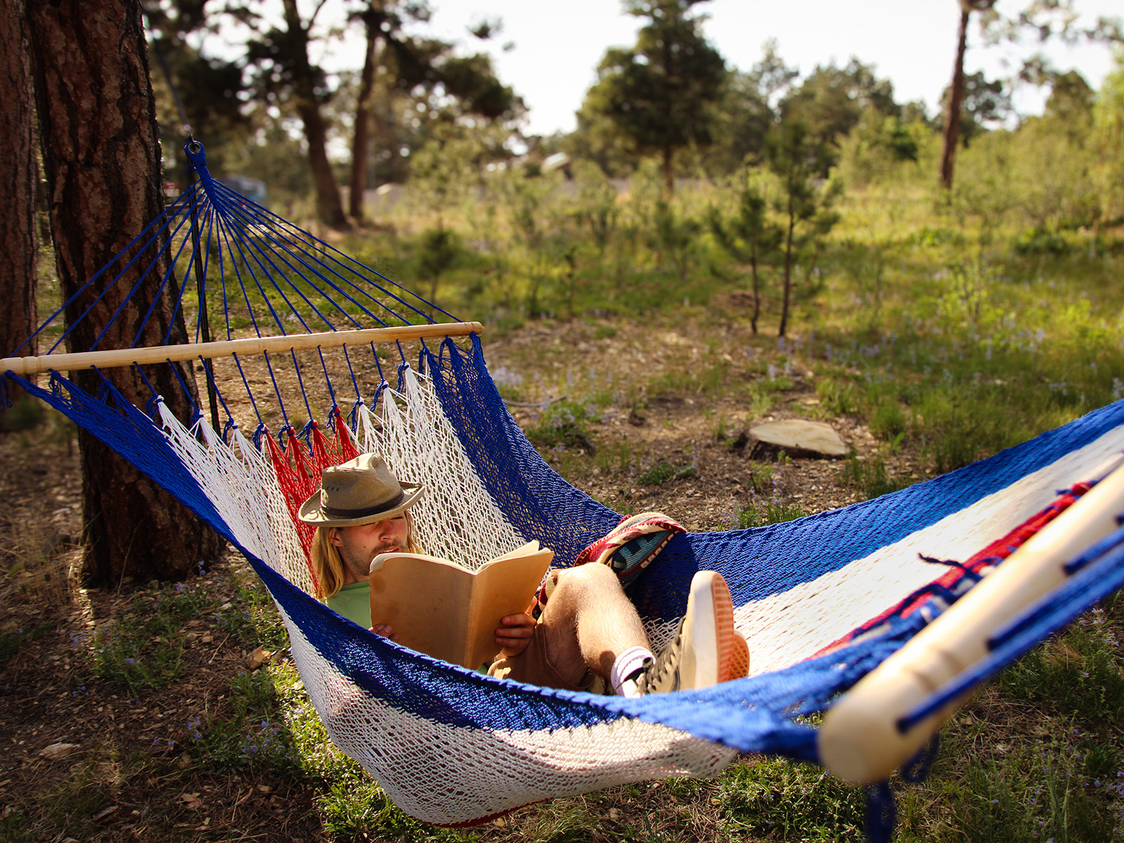 Man reading in a hammock