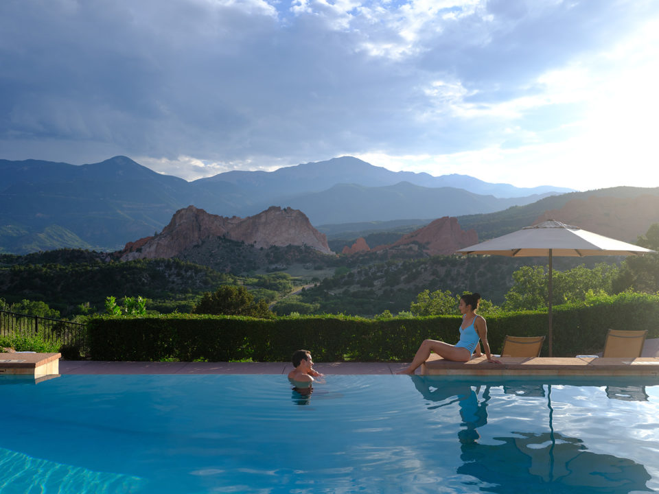 An infinity pool with mountain views
