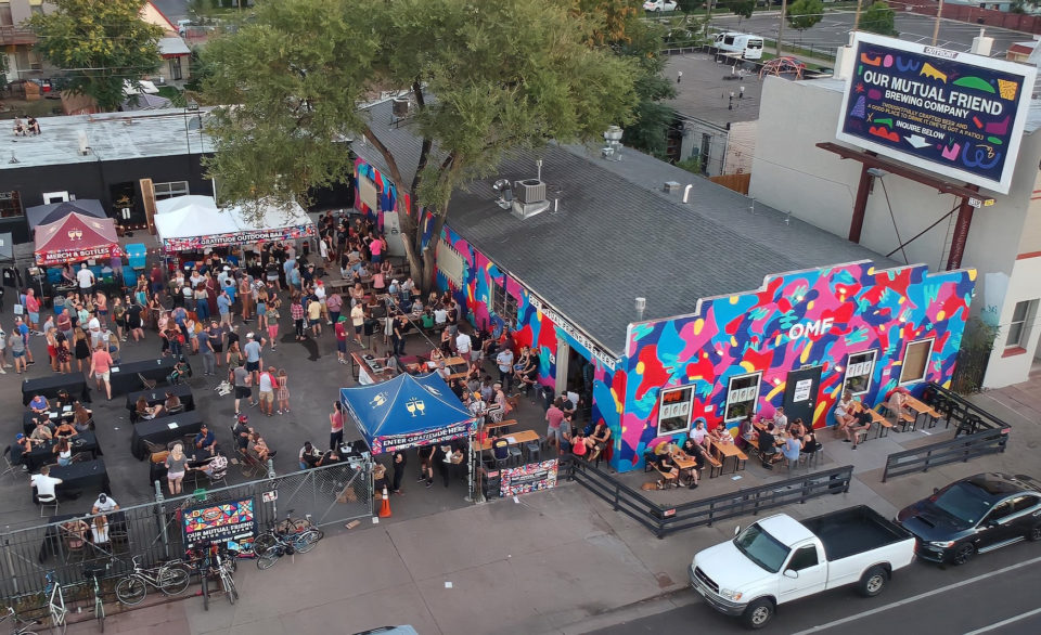 Crowds gather in the parking lot of Our Mutual Friend Brewing during Denver Beer Week