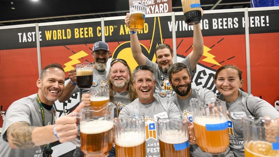 Photos of attendees holding pitchers of beer at GABF 2019. Photo courtesy of the Brewers Association