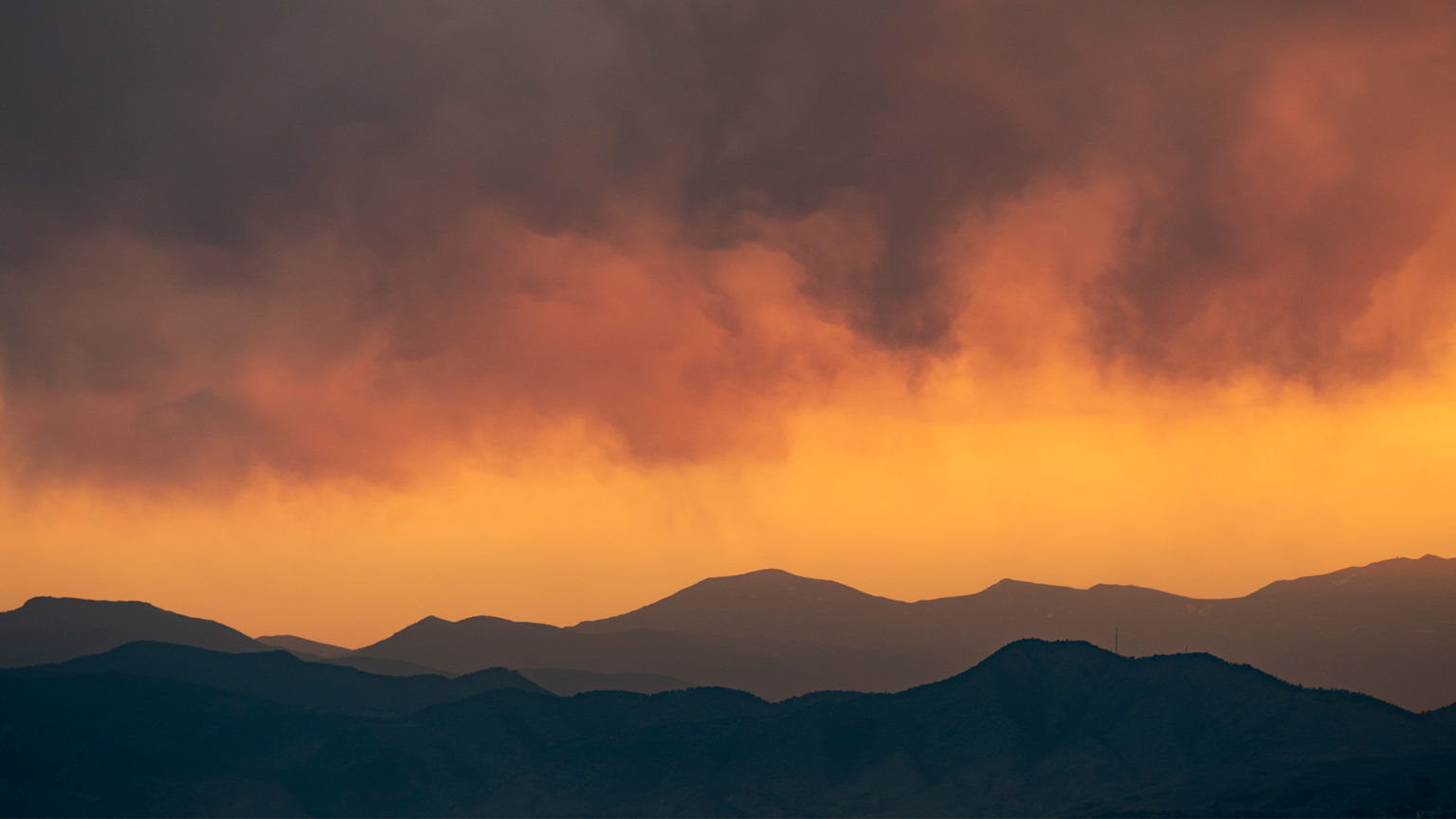 Hazy orange sunset over the Front Range