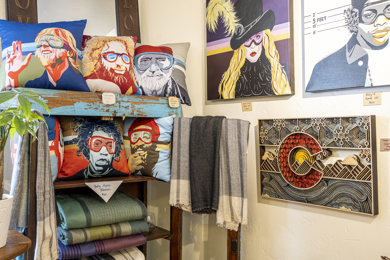 Shop with art and pillows featuring musicians