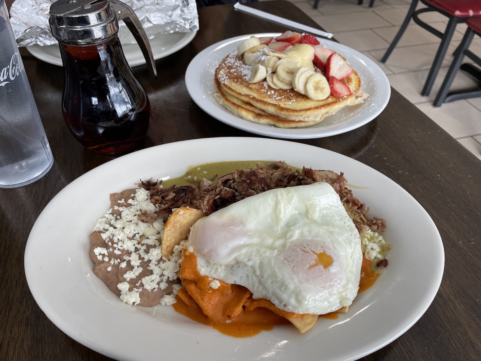 The chilaquiles with red and green chile and carnitas at Santos
