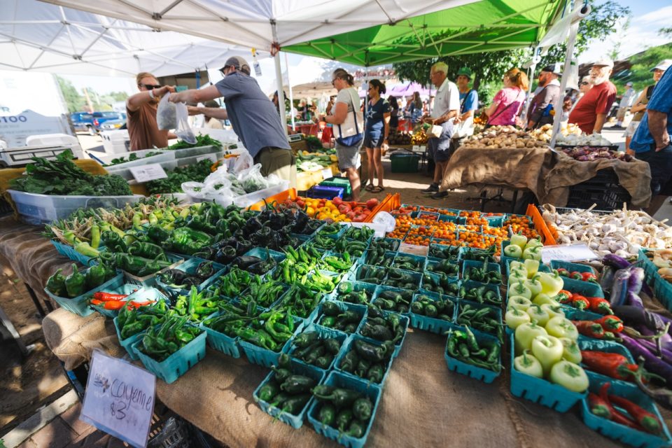 A stand full of peppers at Longmont Farmers Market.