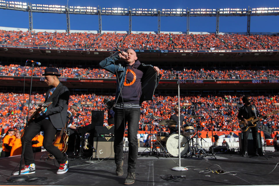 Vocalist Isaac Slade of the rock band The Fray perform during the half time show during the AFC Championship game between the New England Patriots and the Denver Broncos at Sports Authority Field at Mile High on January 19, 2014 in Denver, Colorado