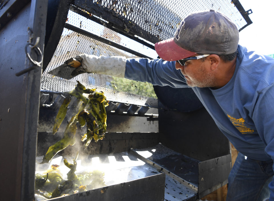 A man roasts Pueblo chiles in the city of Pueblo