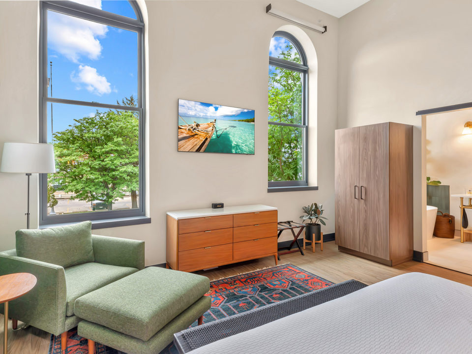 Two arched windows and a seating area