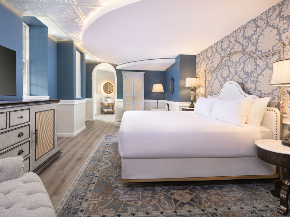 Kings suite with a king-size bed, fireplace, and sitting area