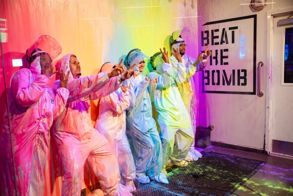 Beat the bomb players in hazmat suits covered in different colors of paint.