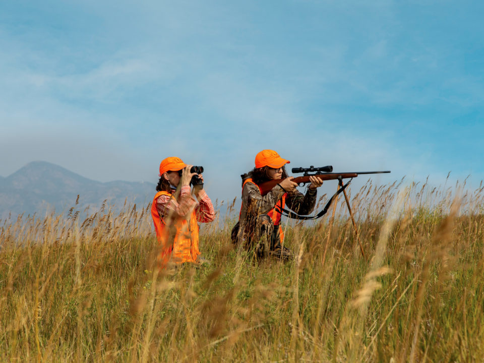 Two women hunting in grasslands in Colorado
