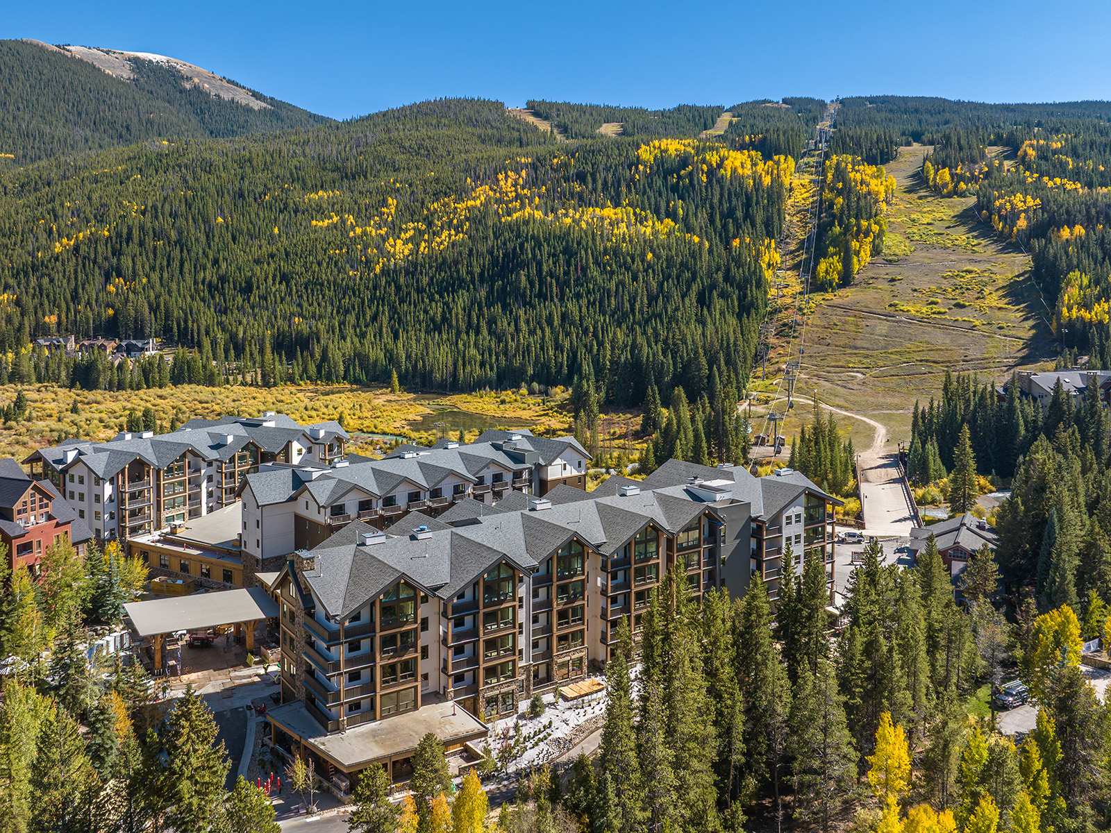 Kindred Resort with yellow aspens on the hillside