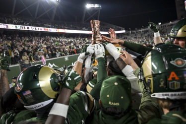 CSU Rams players hoist the Bronze Boot