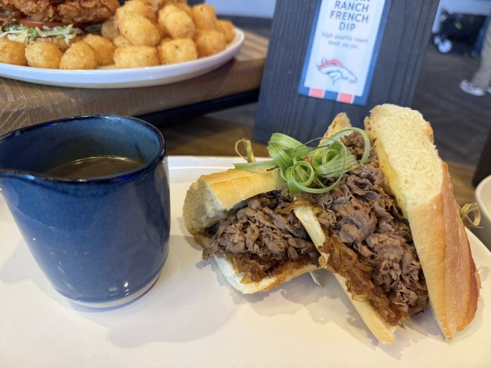 A French dip sandwich with a side of dipping sauce
