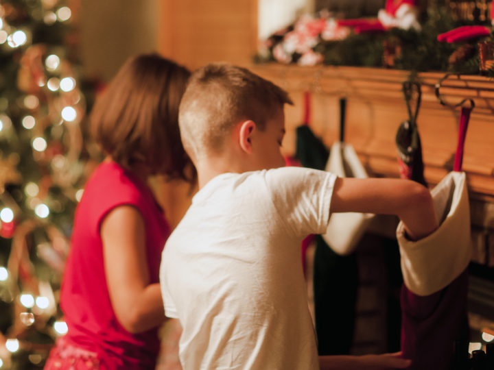 Kids rifling through their Christmas stockings