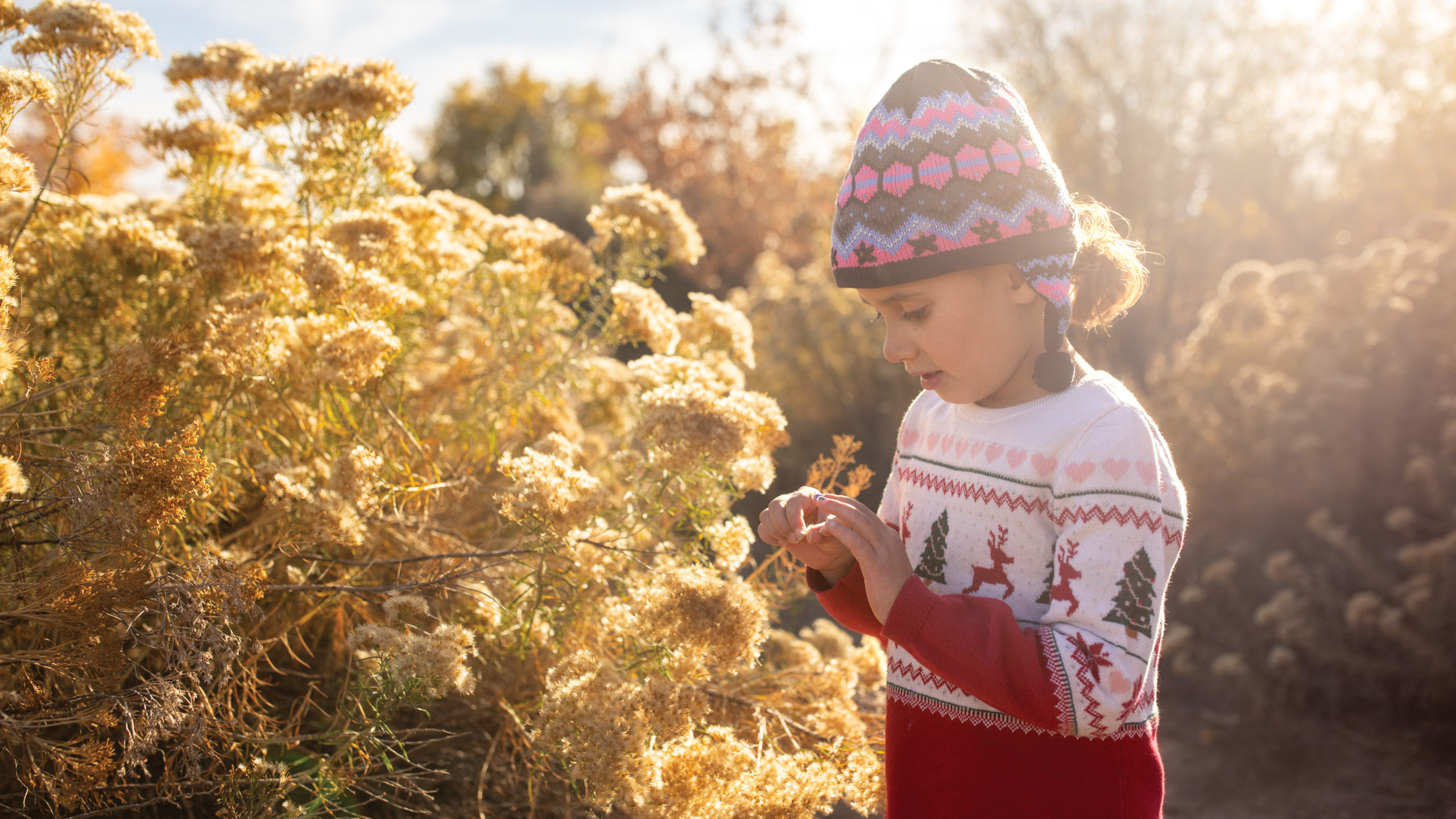 Maya looking at seed pod