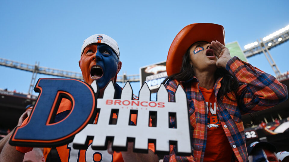 Denver Broncos fans cheer on the team