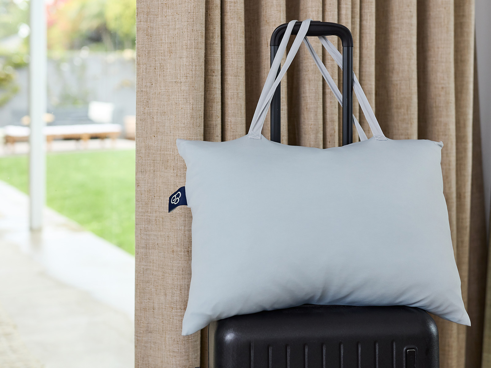 travel pillow on a suitcase