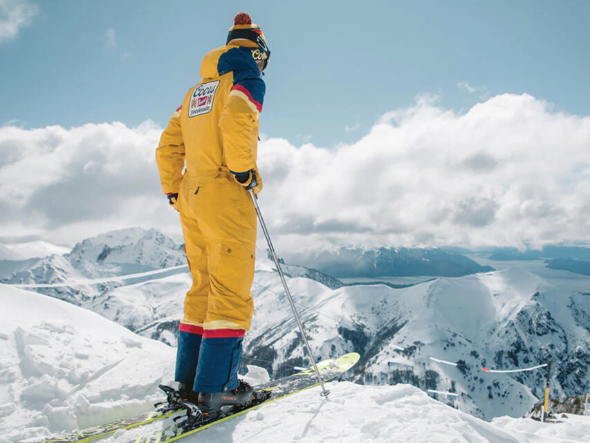 Man in a yellow Coors ski suit