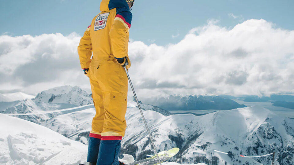Man in a yellow Coors ski suit