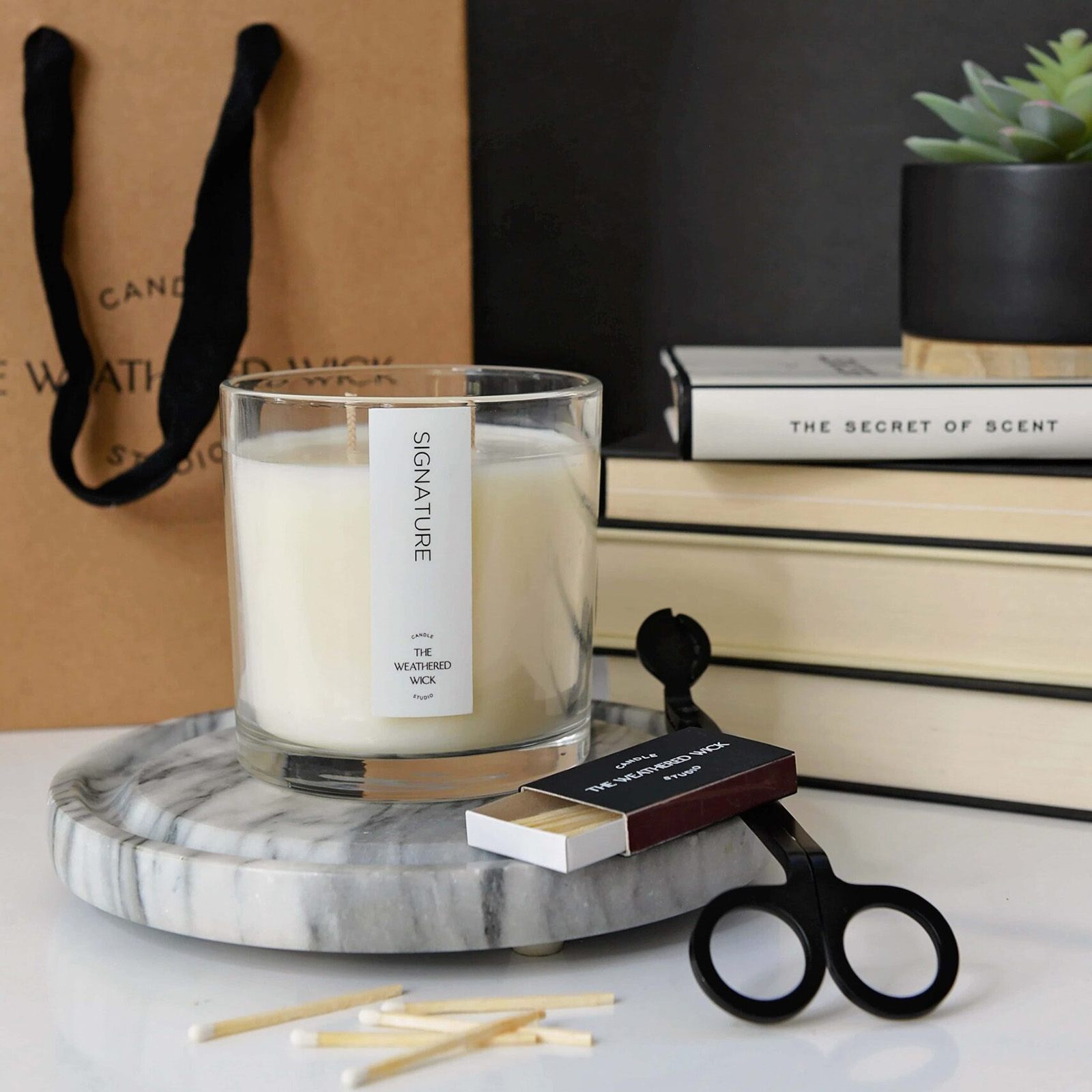 Candle with a trimmer