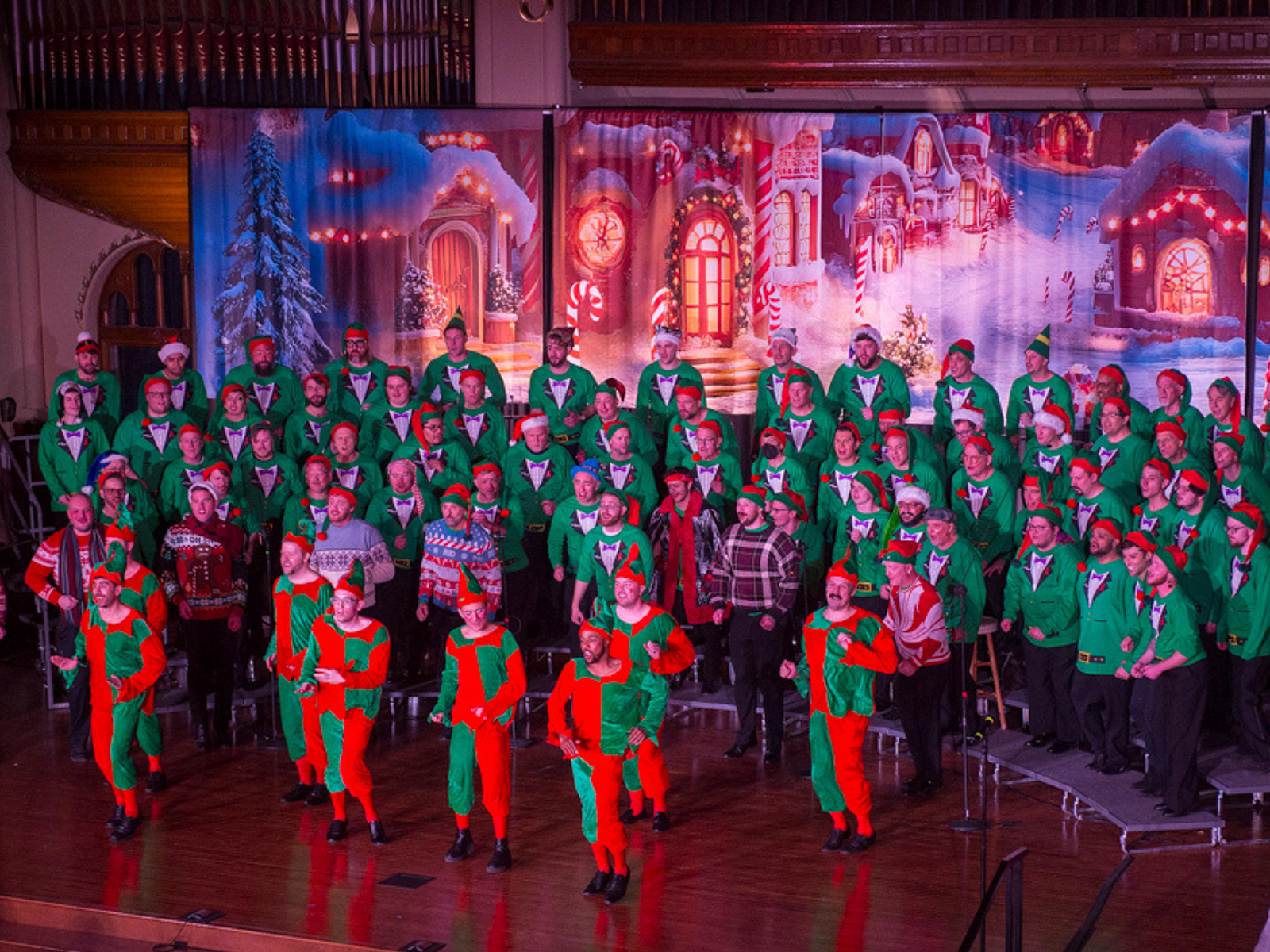 A bunch of men in elf costumes on a stage