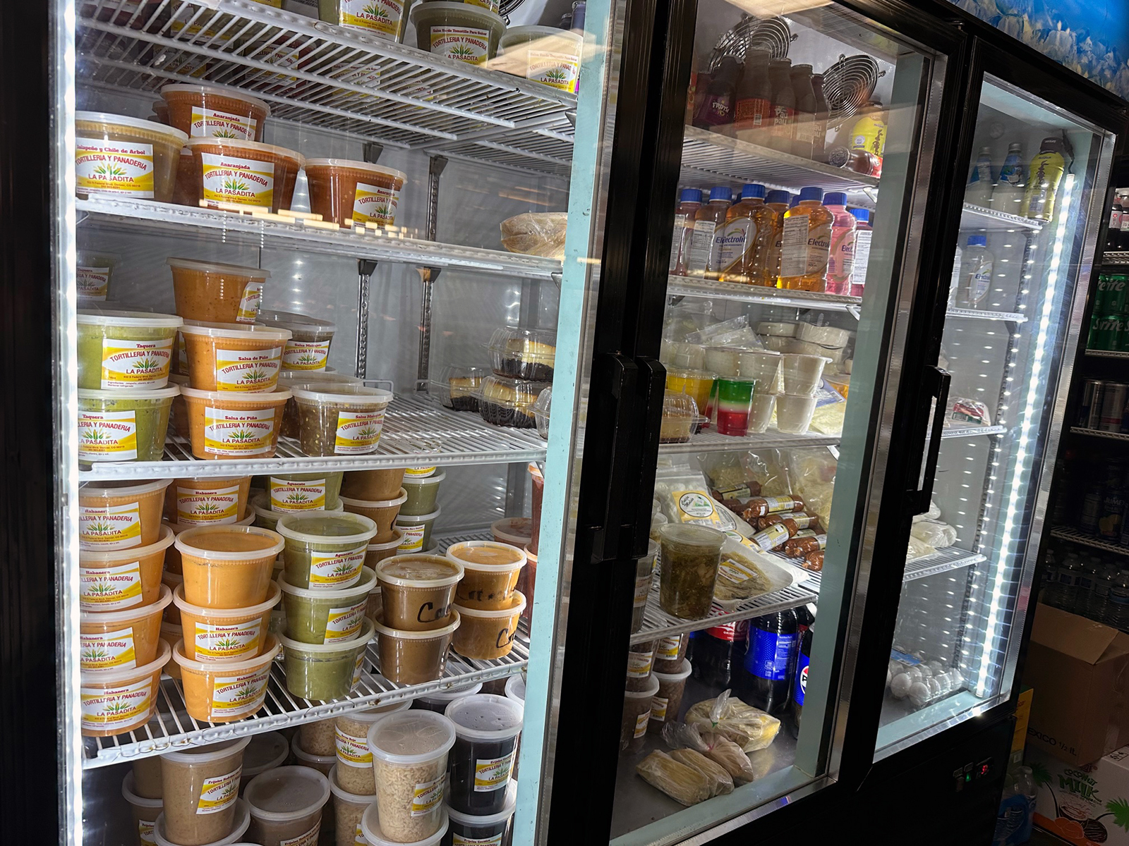 A refrigerator filled with sauces and drinks