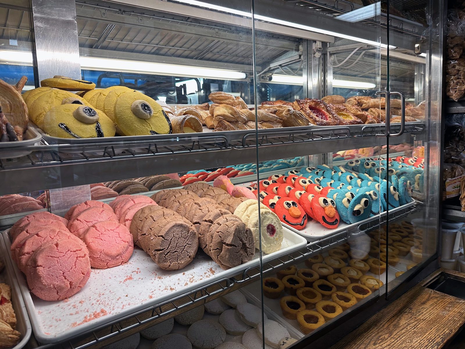 A pastry display of colorful cookies