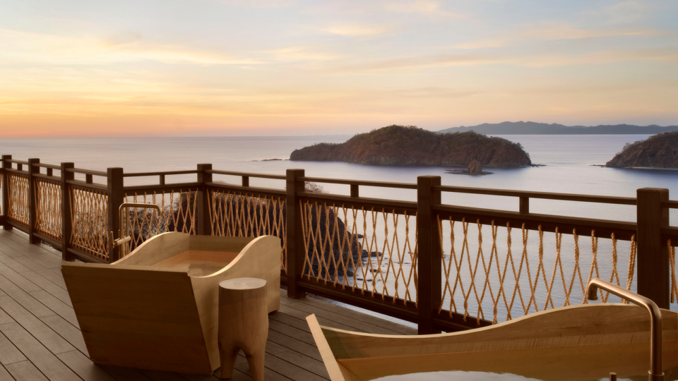 Outdoor tubs on a patio overlooking the ocean