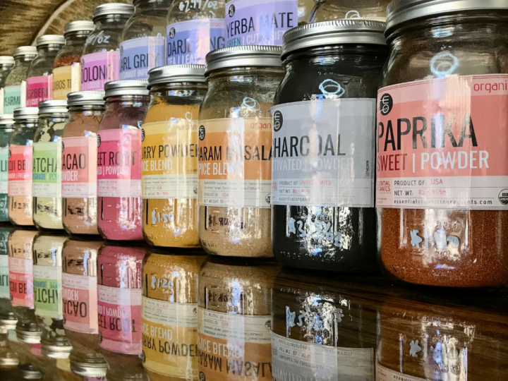 A row of jarred spices at Off the Bottle