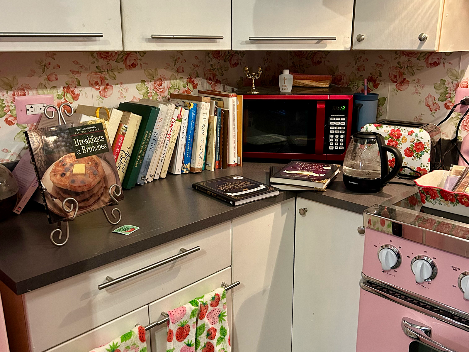 Cookbooks in a pink kitchen