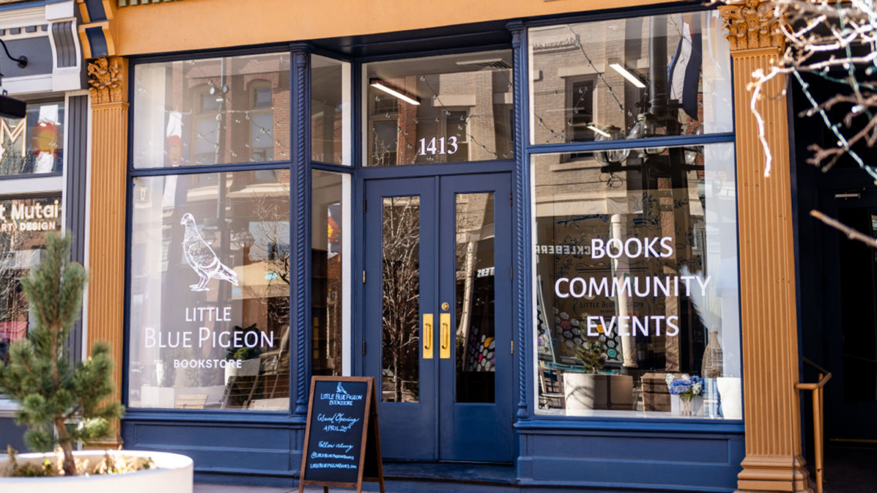 A dark blue storefront of a bookstore