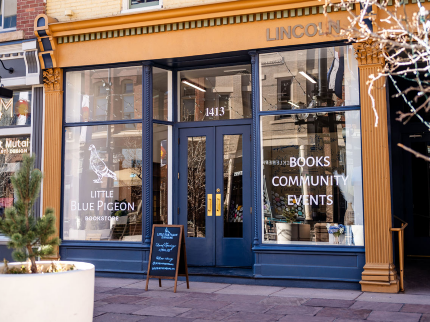 A dark blue storefront of a bookstore