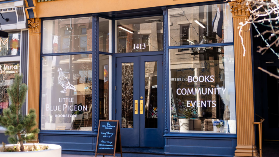 A dark blue storefront of a bookstore