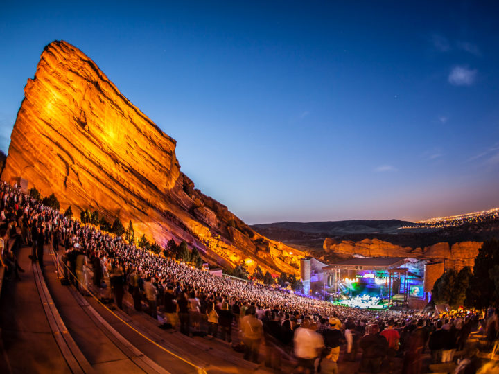 Red Rocks Amphitheatre at dusk with a full crowd