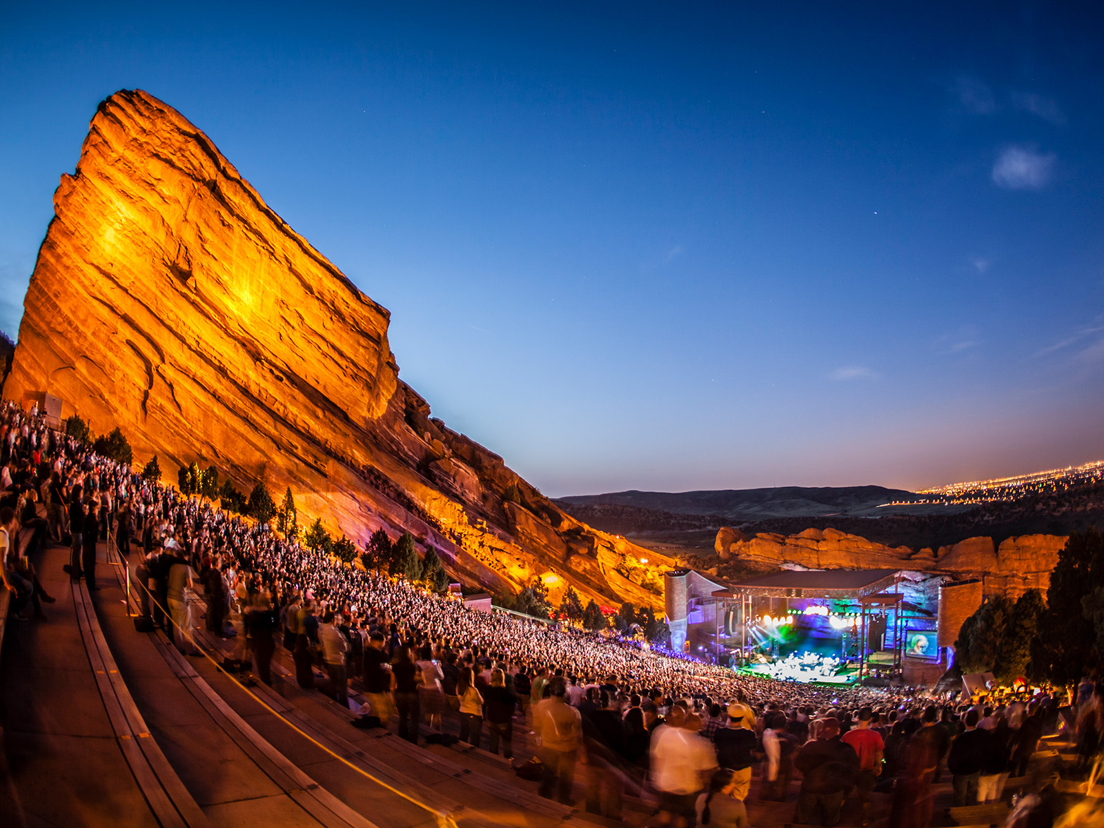 Red Rocks Amphitheatre at dusk with a full crowd