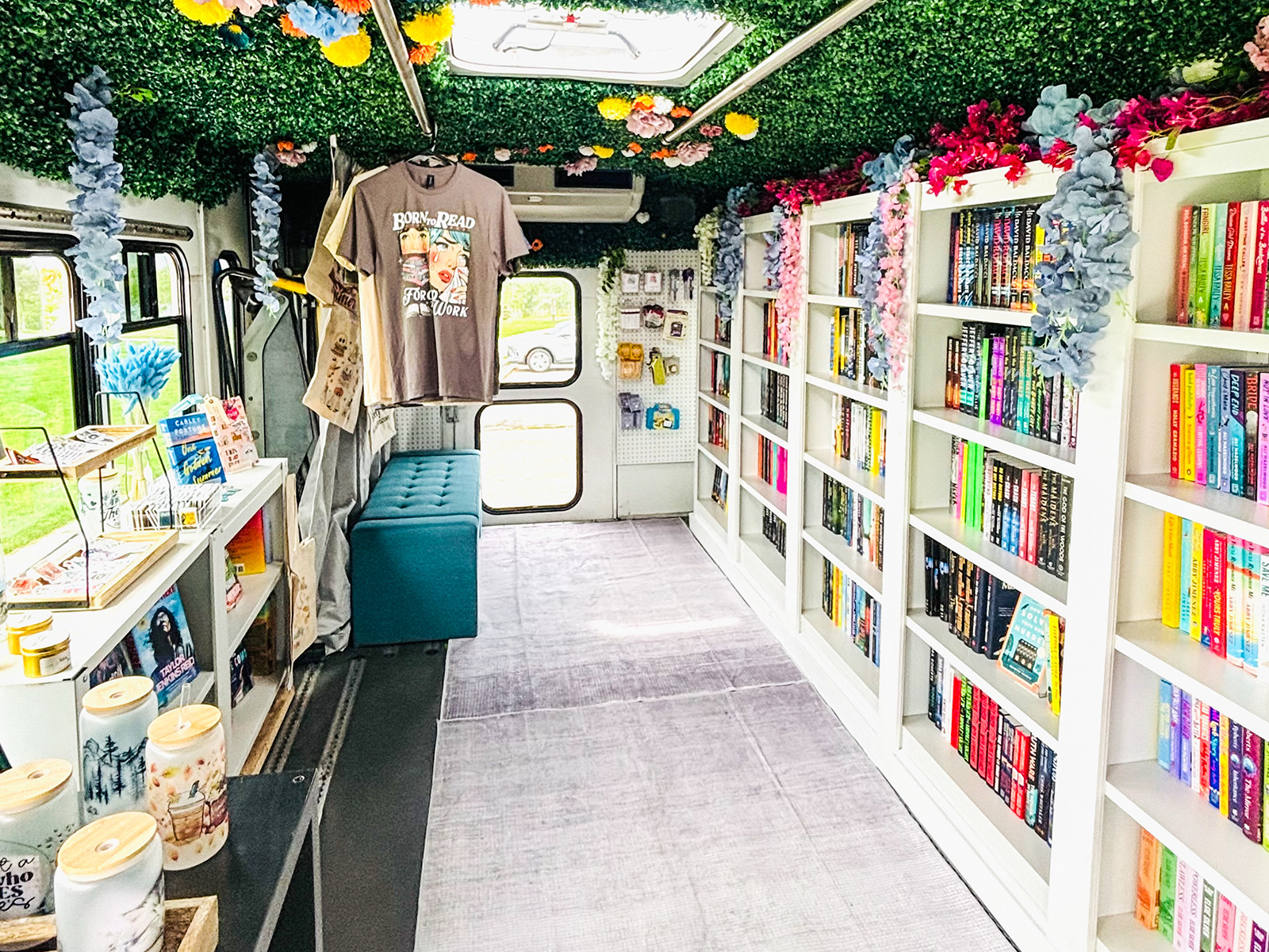 A minibus converted into a bookstore with shelves and merchandise