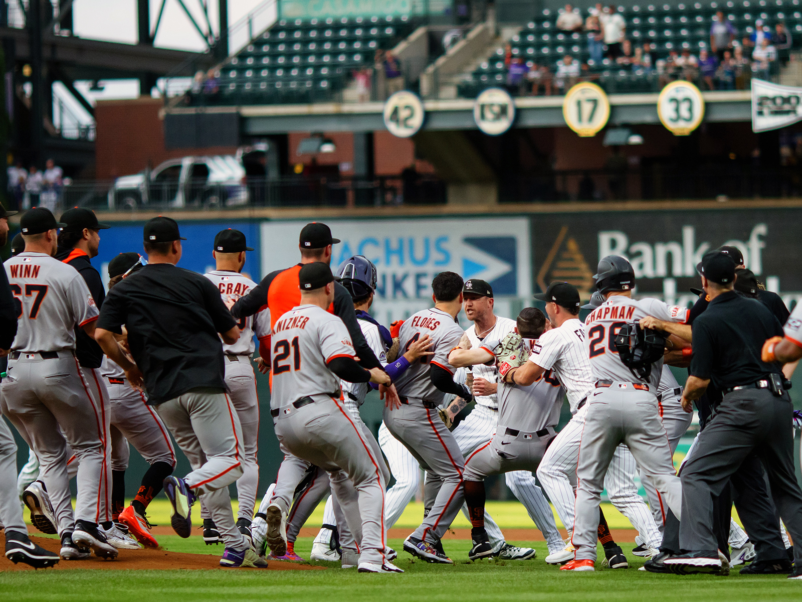The San Francisco Giants and Colorado Rockies fight on the field