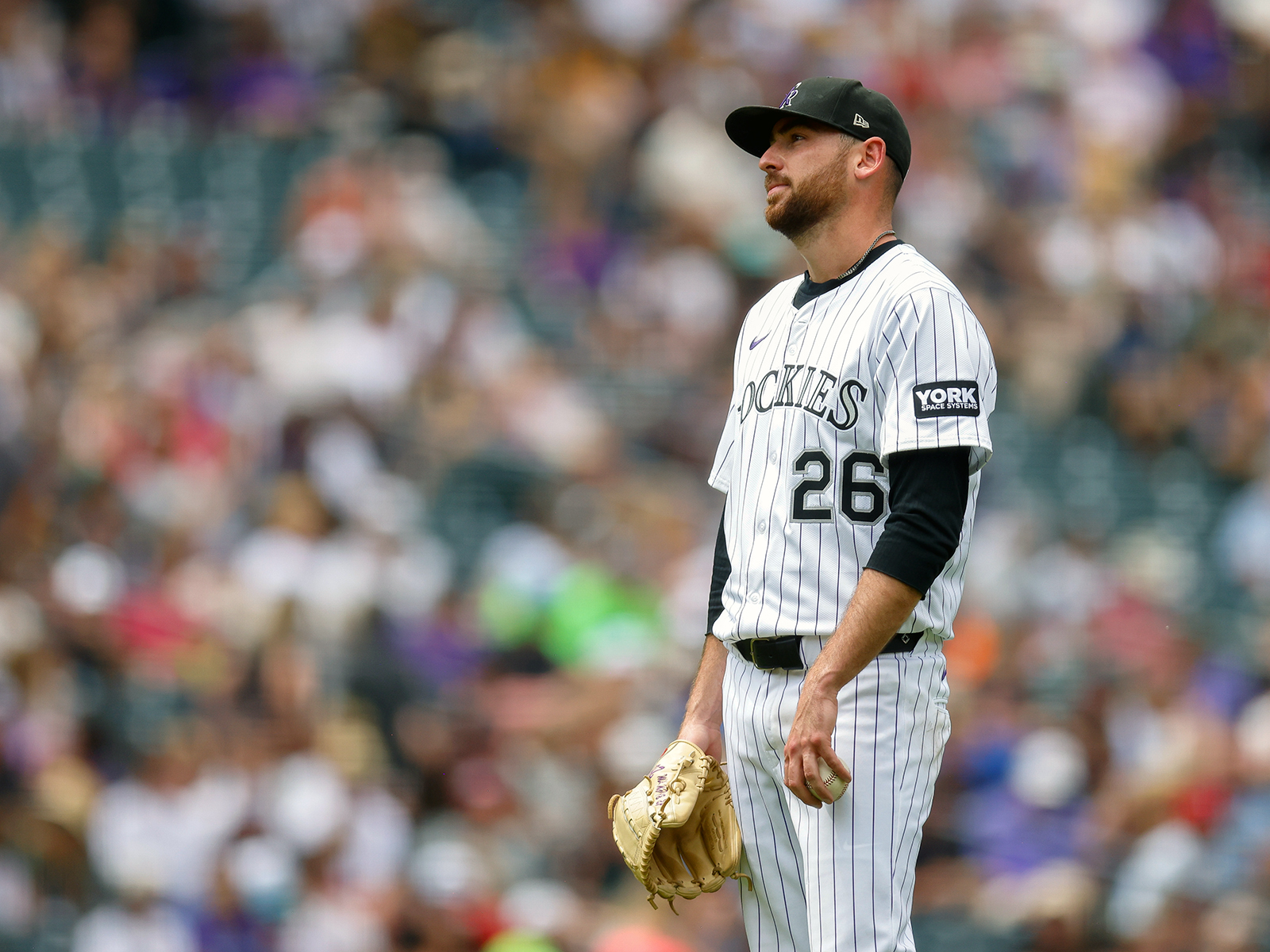 Austin Gomber reacts after giving up a three-run home run