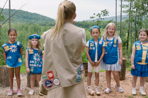 Girl scouts stand in a line