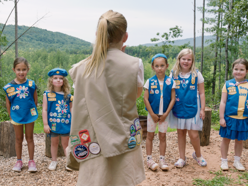 Girl scouts stand in a line