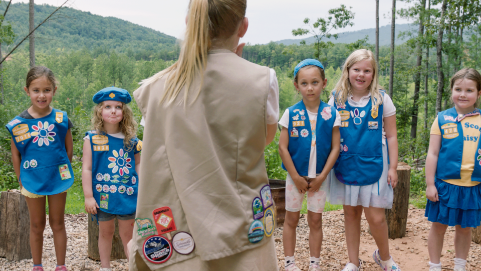 Girl scouts stand in a line